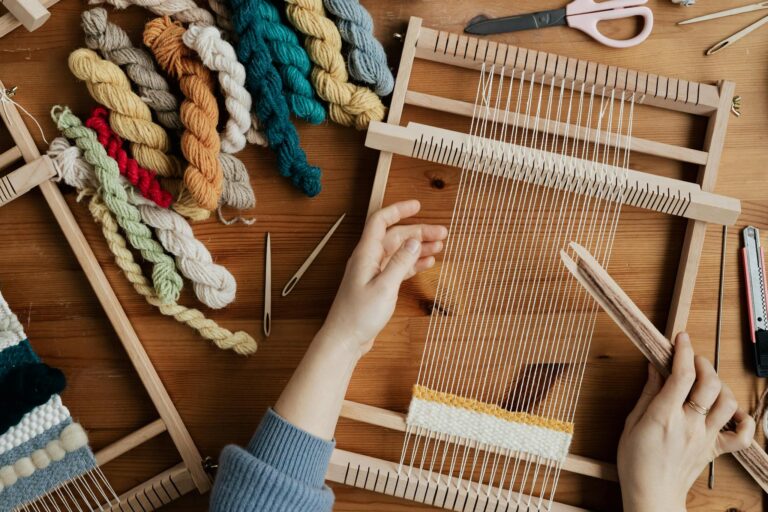 Top View Photo of Person Weaving Using Hand Loom