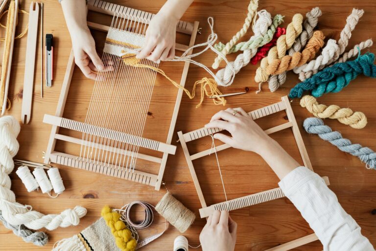 Top View Photo of Two Person's Hands Weaving